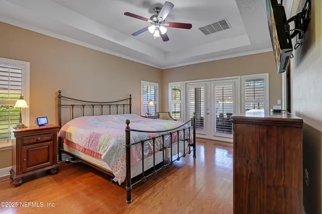 a bathroom with a double vanity sink mirror and a bathtub