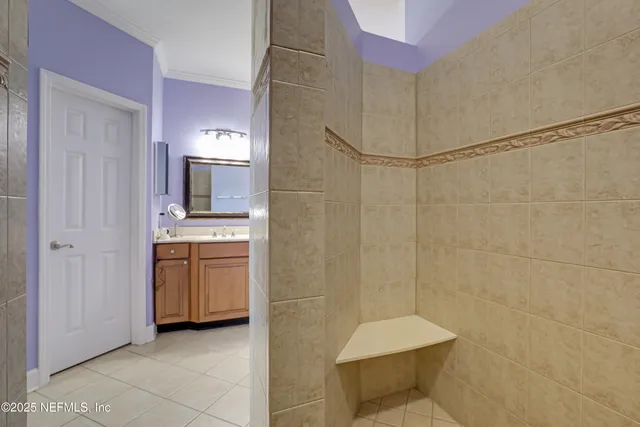 a kitchen with stainless steel appliances granite countertop a sink refrigerator and cabinets