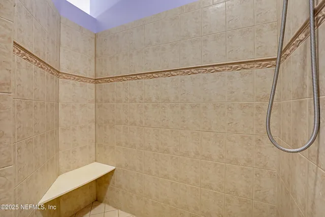 a kitchen with stainless steel appliances a refrigerator sink and cabinets