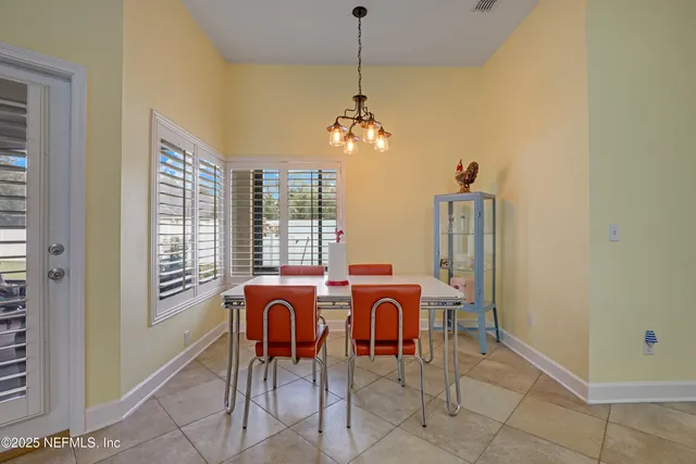 a view of a room with furniture and wooden floor