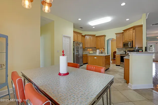 a view of an empty room with a chandelier