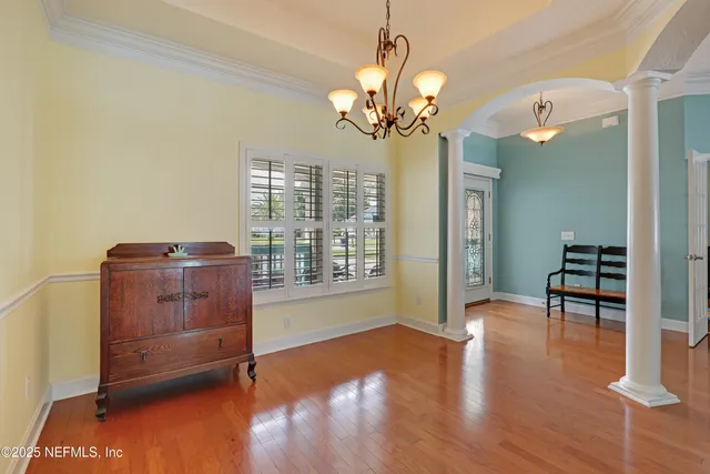a view of yard with swimming pool and green space