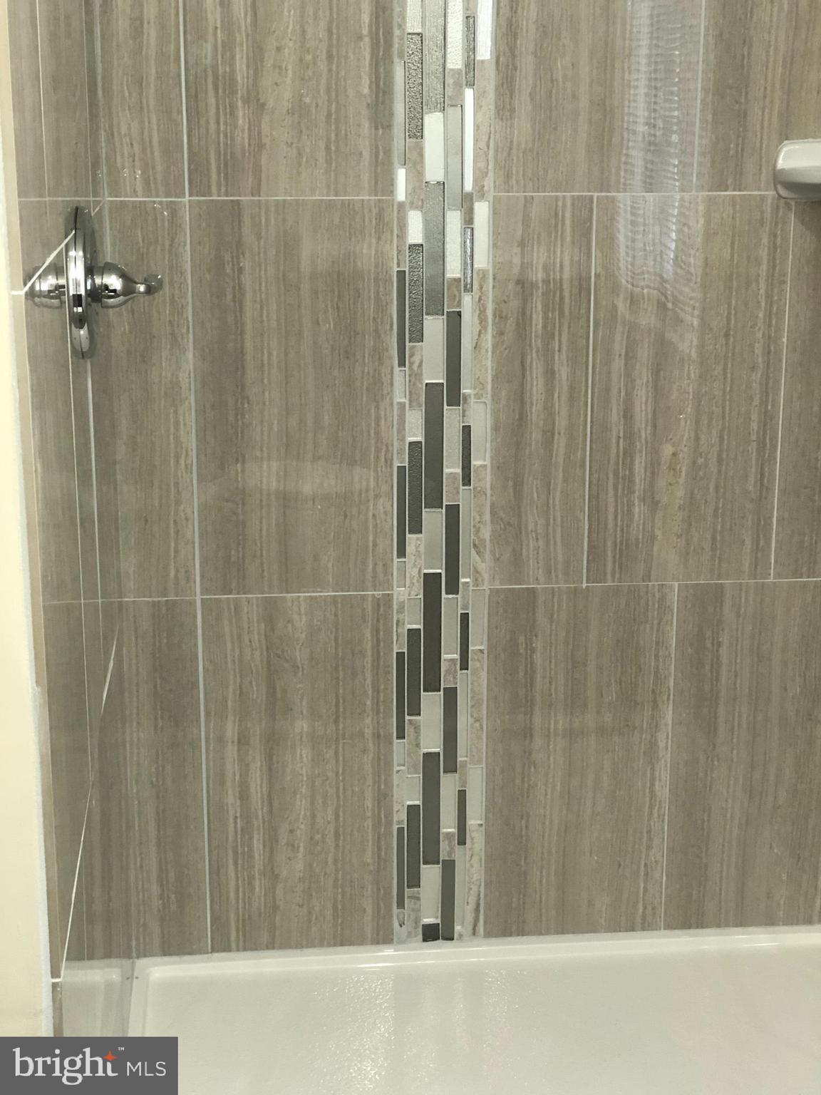 9925 Sutherland Road Silver Spring, MD 20901 - Photo 12 of 15 a bathroom with a shower