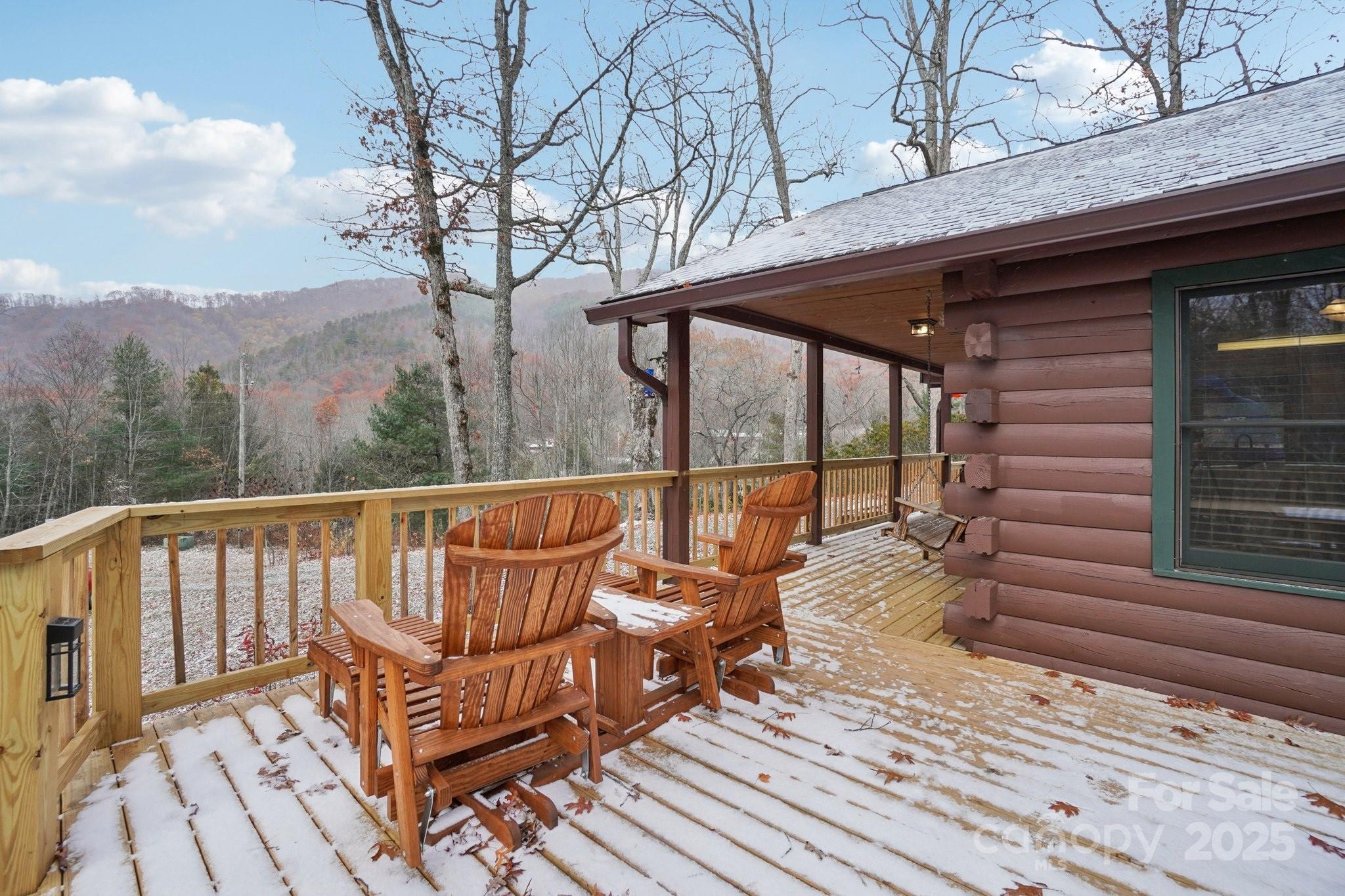 804 Ledbetter Road Robbinsville, NC 28771 - Photo 13 of 27 a view of a chairs on the roof deck