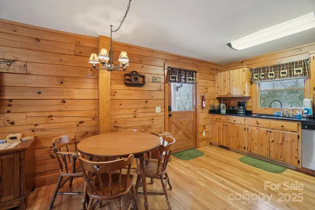 a dining room with furniture and wooden floor