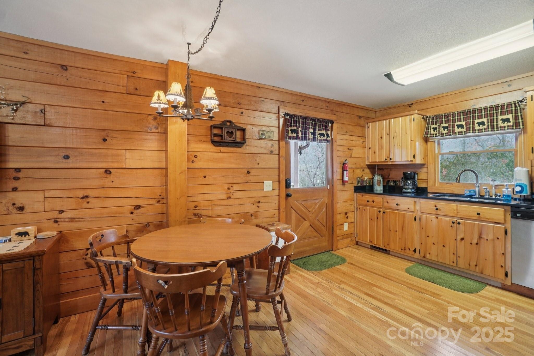 804 Ledbetter Road Robbinsville, NC 28771 - Photo 16 of 27 a kitchen with stainless steel appliances kitchen island a table and chairs in it