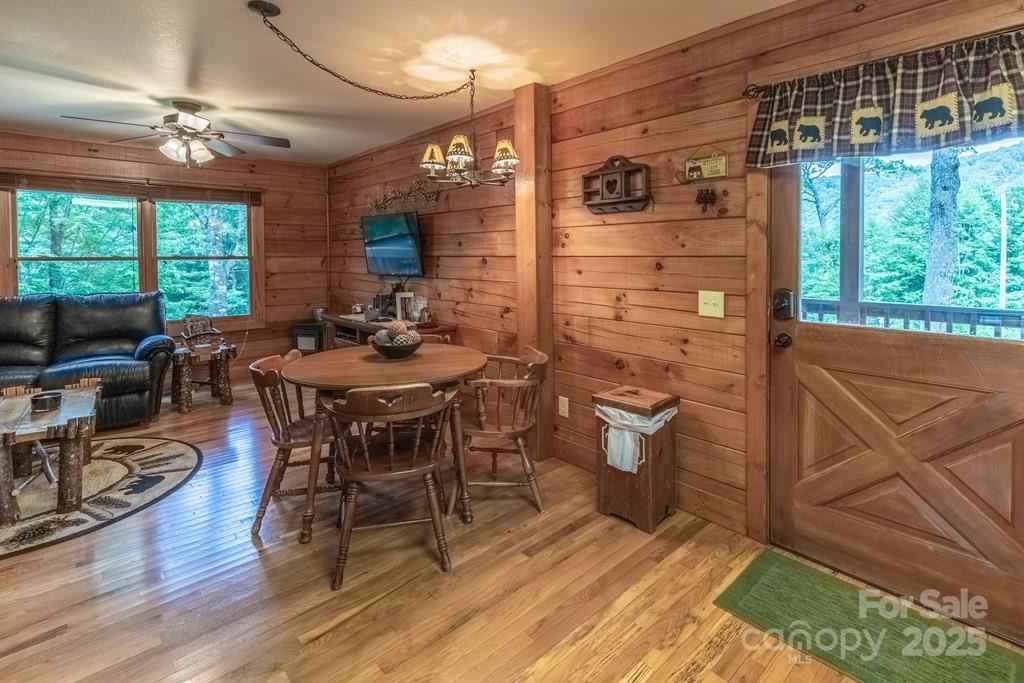 804 Ledbetter Road Robbinsville, NC 28771 - Photo 17 of 27 a dining room with furniture and wooden floor