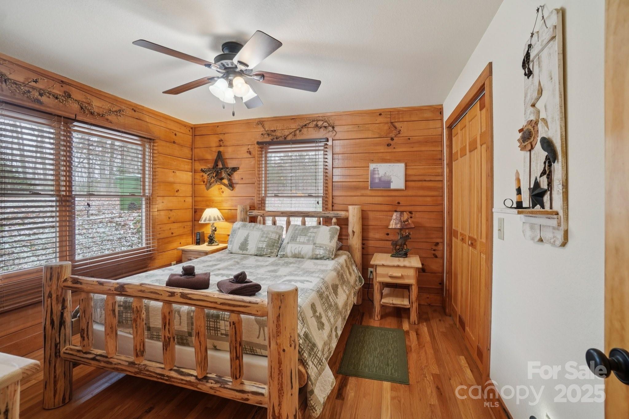 804 Ledbetter Road Robbinsville, NC 28771 - Photo 20 of 27 a bedroom with a bed next to a large window