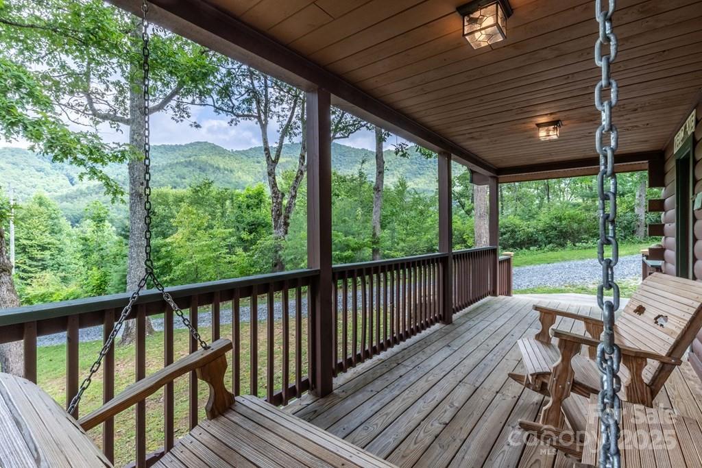 804 Ledbetter Road Robbinsville, NC 28771 - Photo 26 of 27 a view of a patio with wooden floor chairs and iron stairs