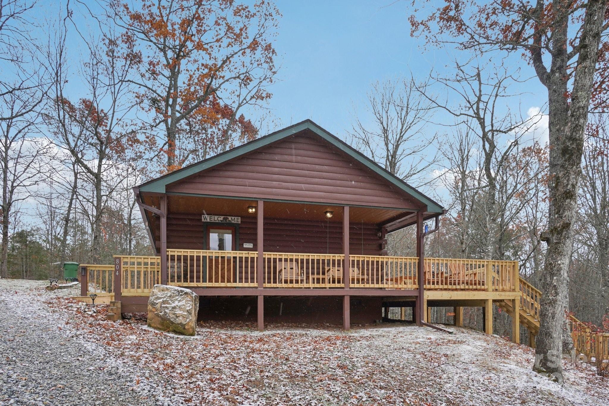 804 Ledbetter Road Robbinsville, NC 28771 - Photo 8 of 27 a view of a house with a deck and a yard