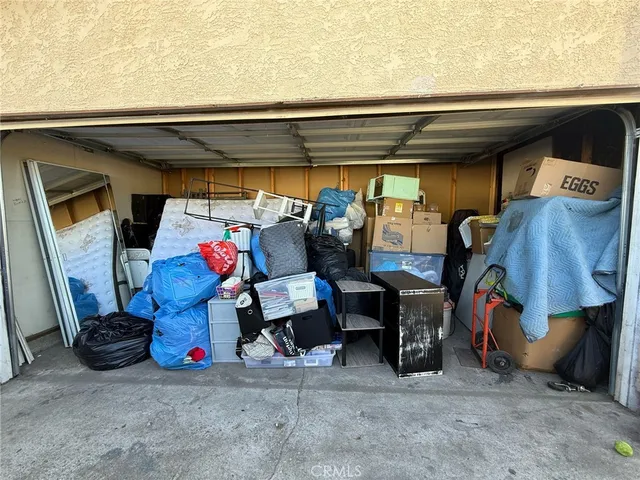 a bed room with a bed and a ceiling fan
