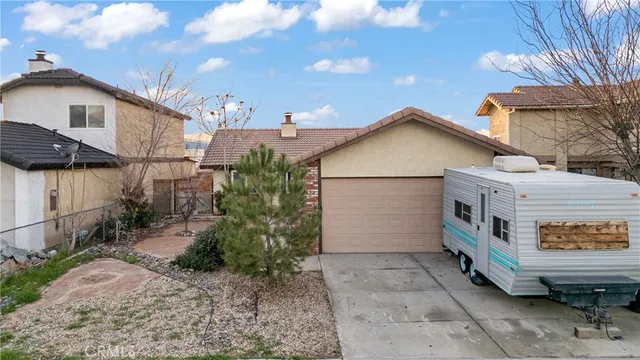 a view of a house and a yard