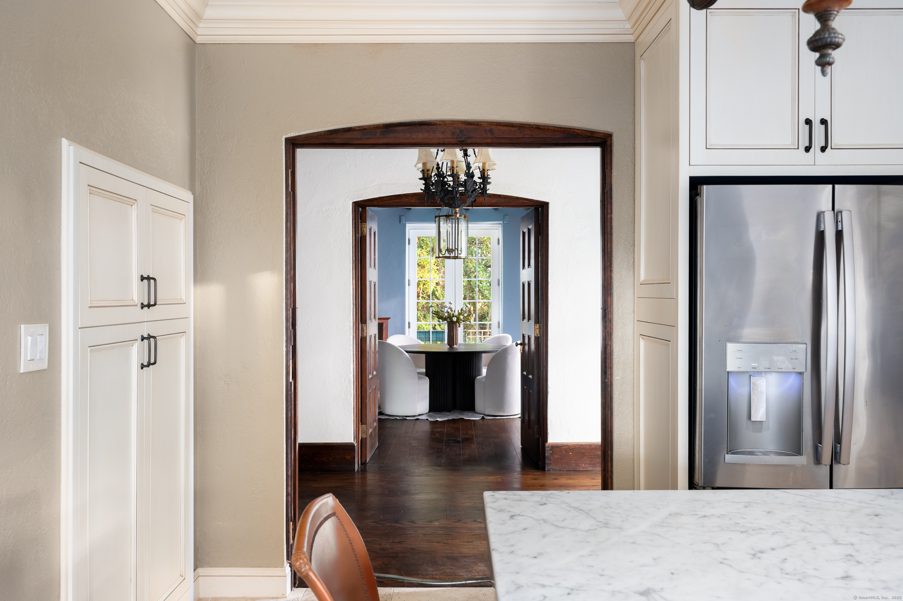 271 Hunting Ridge Road Stamford, CT 06903 - Photo 15 of 40 a view of a hallway with wooden floor windows and a livingroom