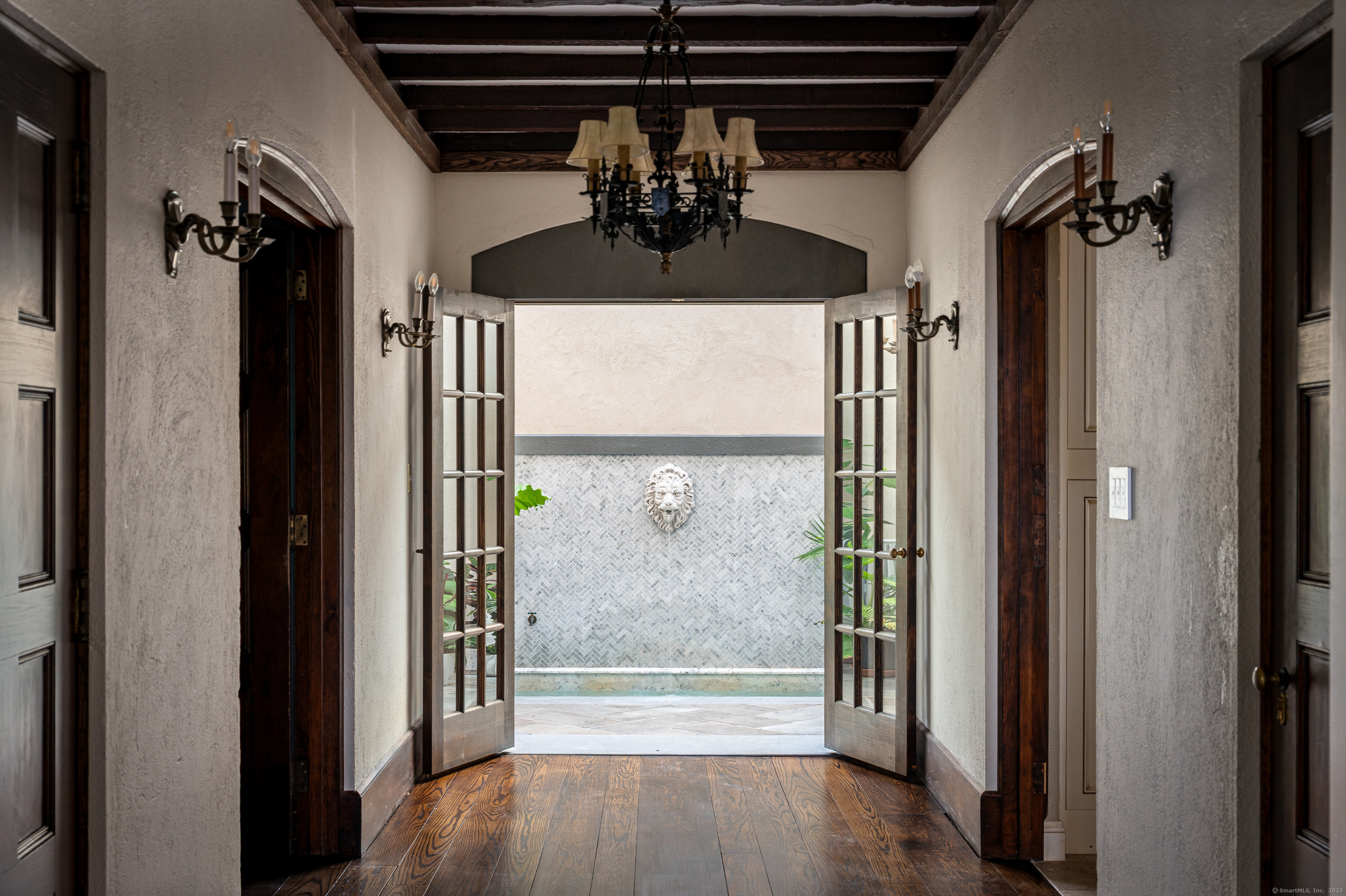271 Hunting Ridge Road Stamford, CT 06903 - Photo 16 of 40 a view of a hallway with a chandelier