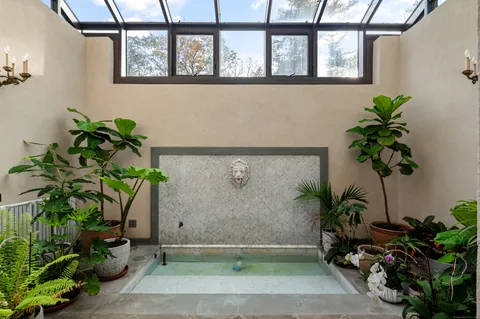 a view of a hallway with a wooden door