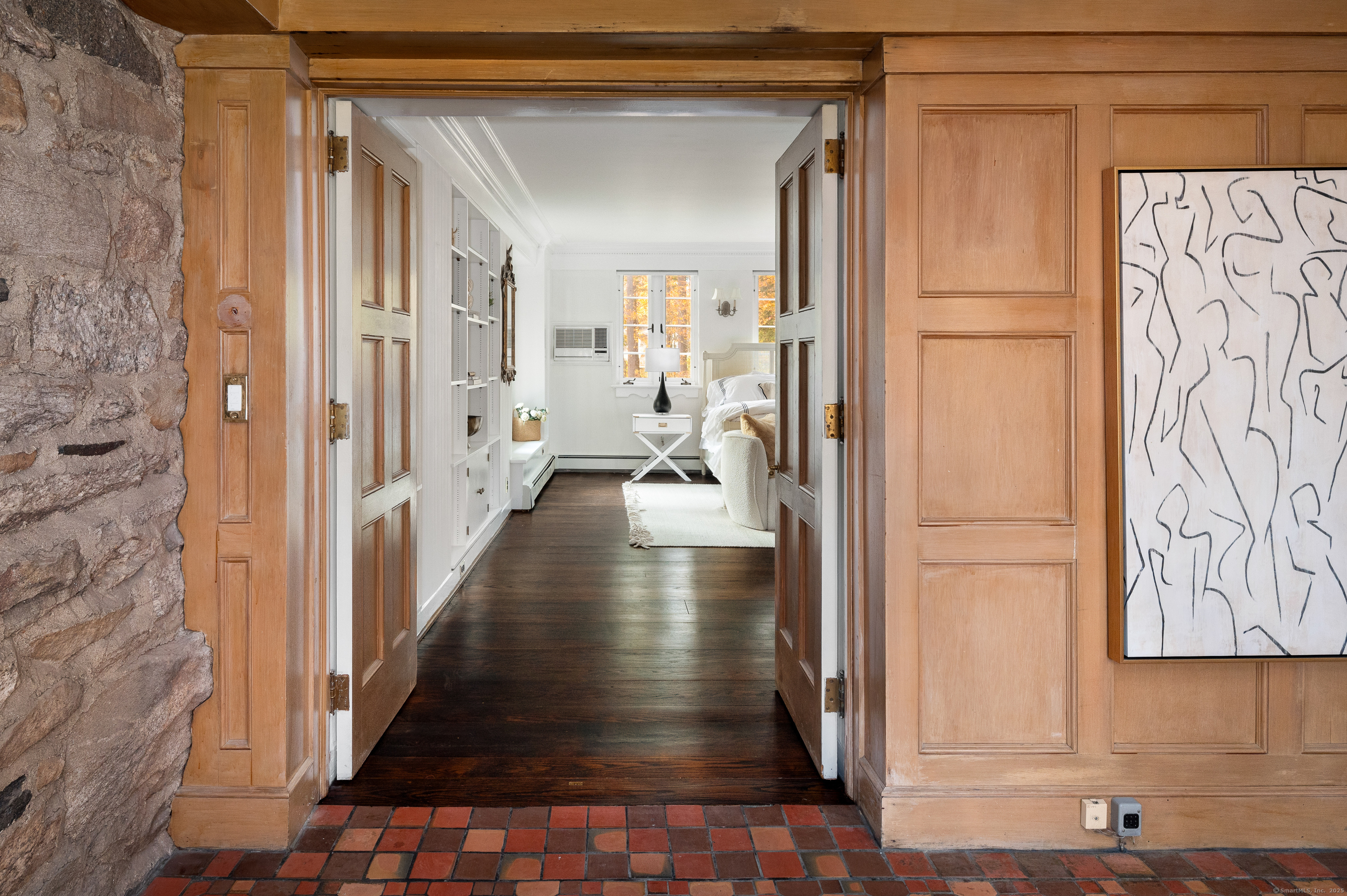 271 Hunting Ridge Road Stamford, CT 06903 - Photo 19 of 40 a view of a hallway with a wooden door