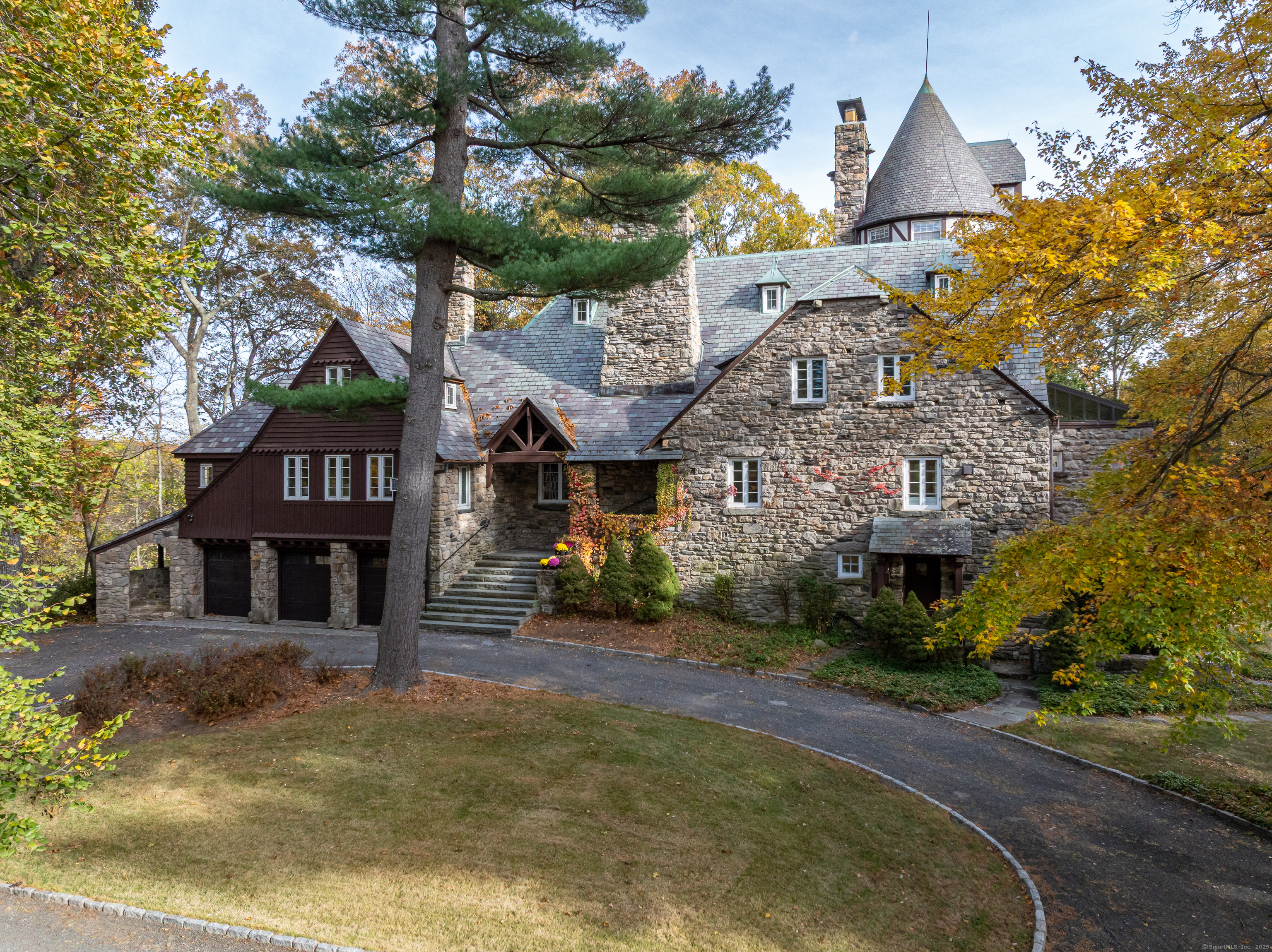 271 Hunting Ridge Road Stamford, CT 06903 - Photo 2 of 40 a front view of a house with a yard