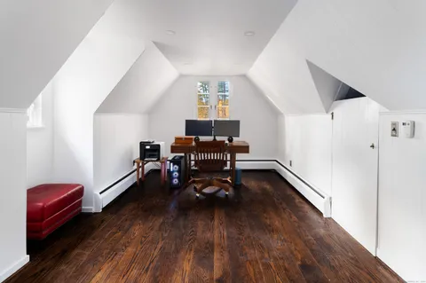 a bedroom with a bed and a fireplace
