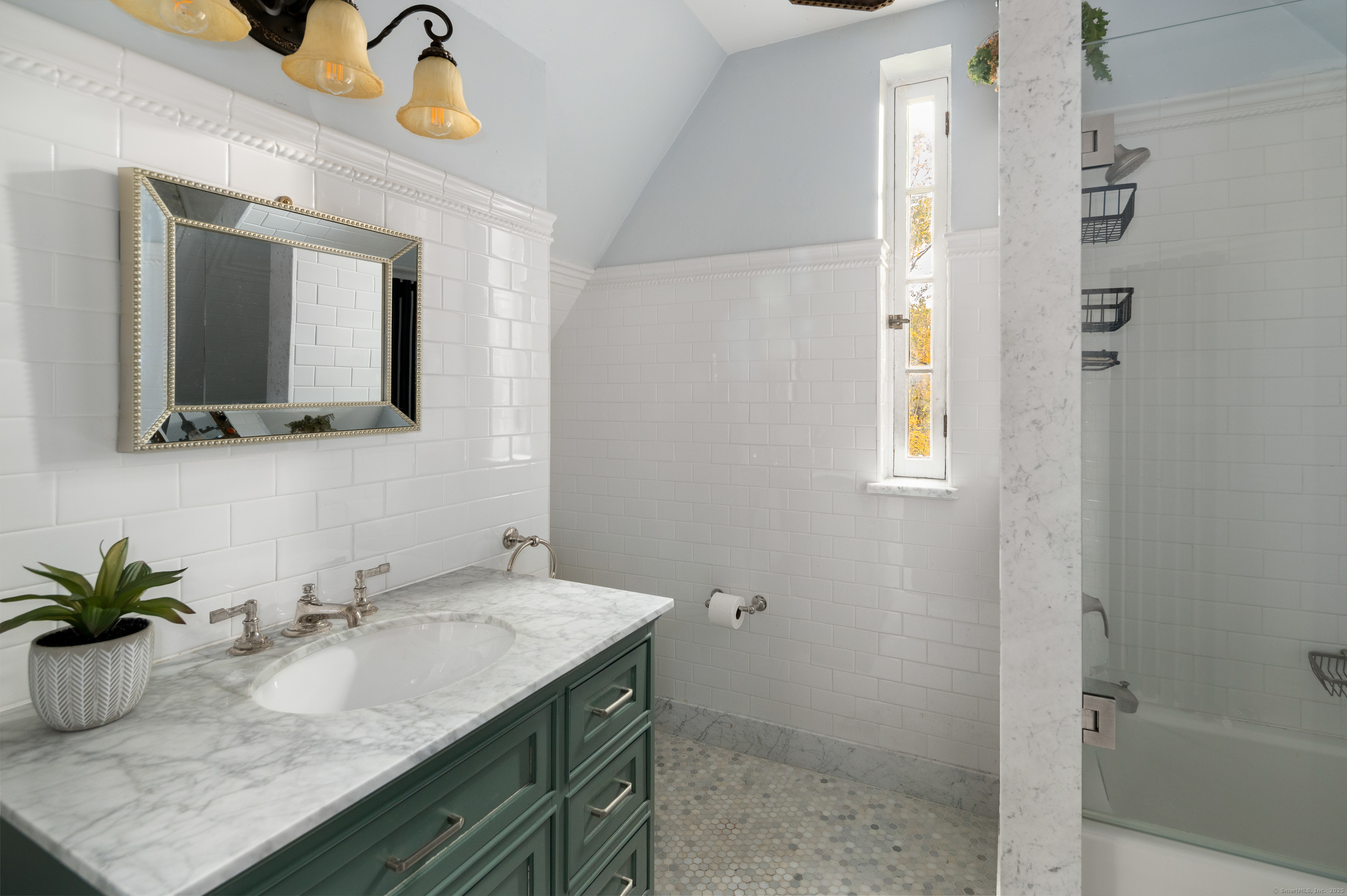 271 Hunting Ridge Road Stamford, CT 06903 - Photo 29 of 40 a bathroom with a granite countertop sink and a mirror