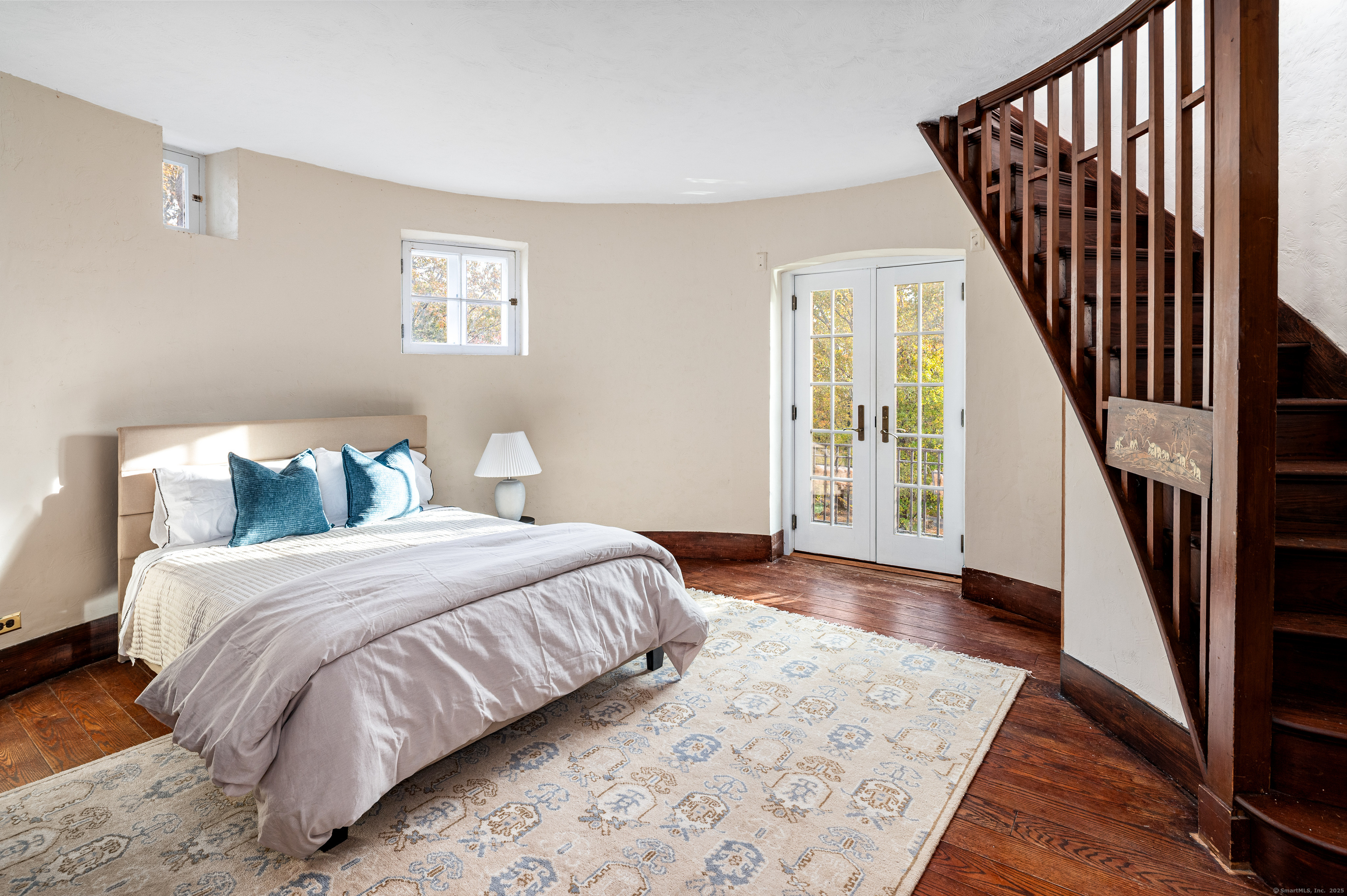 271 Hunting Ridge Road Stamford, CT 06903 - Photo 30 of 40 a bedroom with a bed and wooden floor