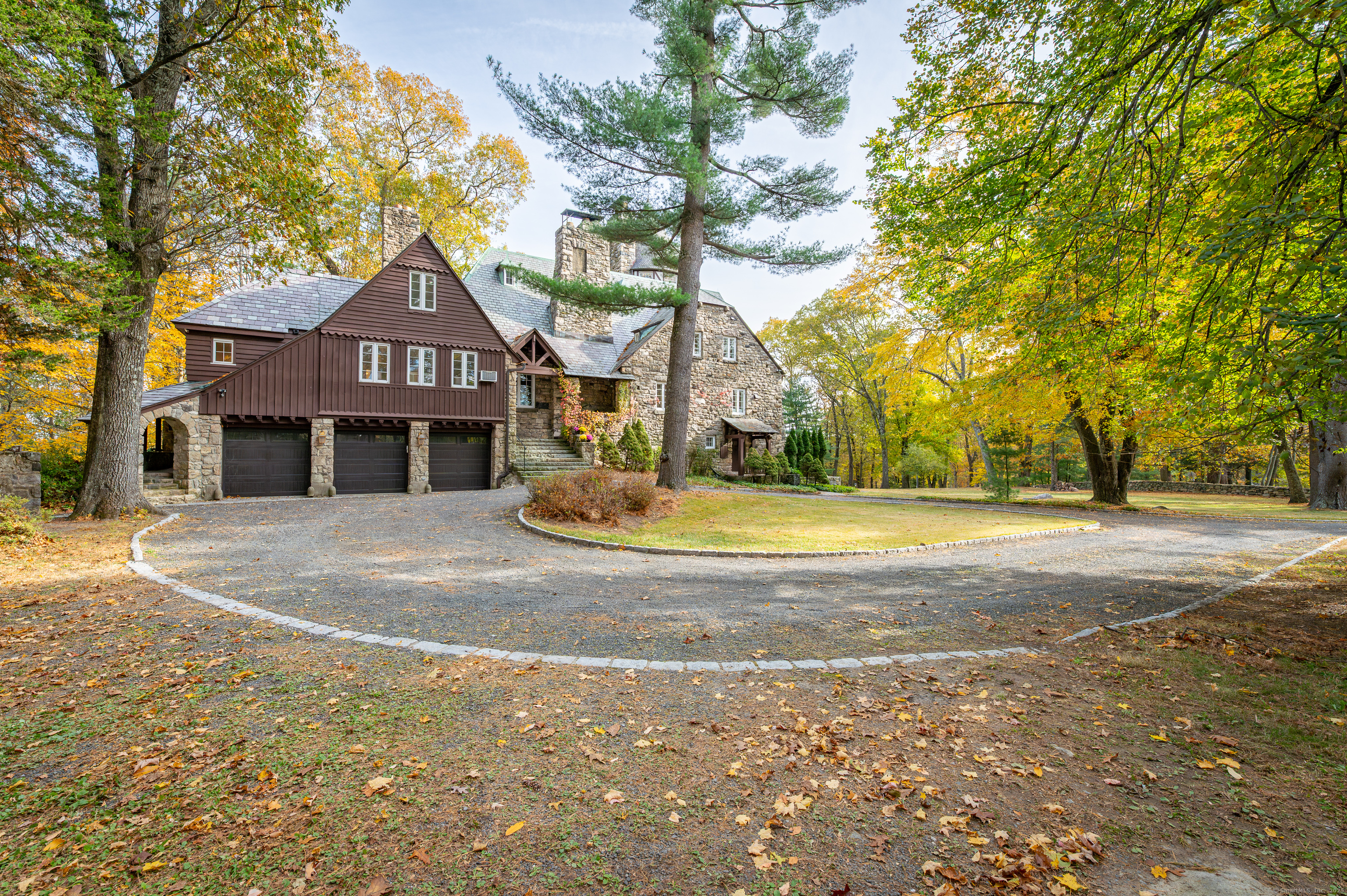 271 Hunting Ridge Road Stamford, CT 06903 - Photo 3 of 40 a front view of a house with a yard