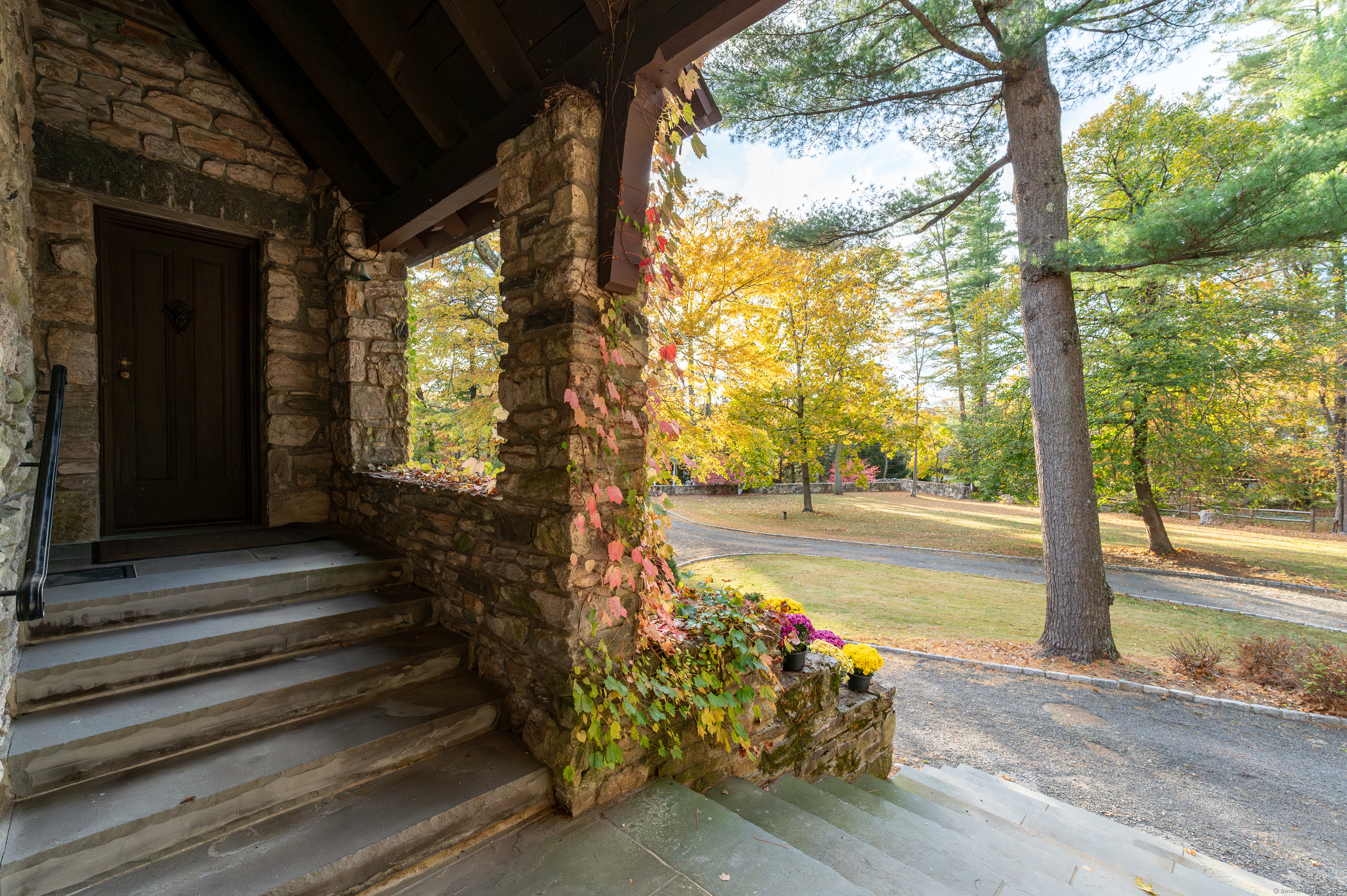 271 Hunting Ridge Road Stamford, CT 06903 - Photo 5 of 40 a view of a pathway of a house with a garden