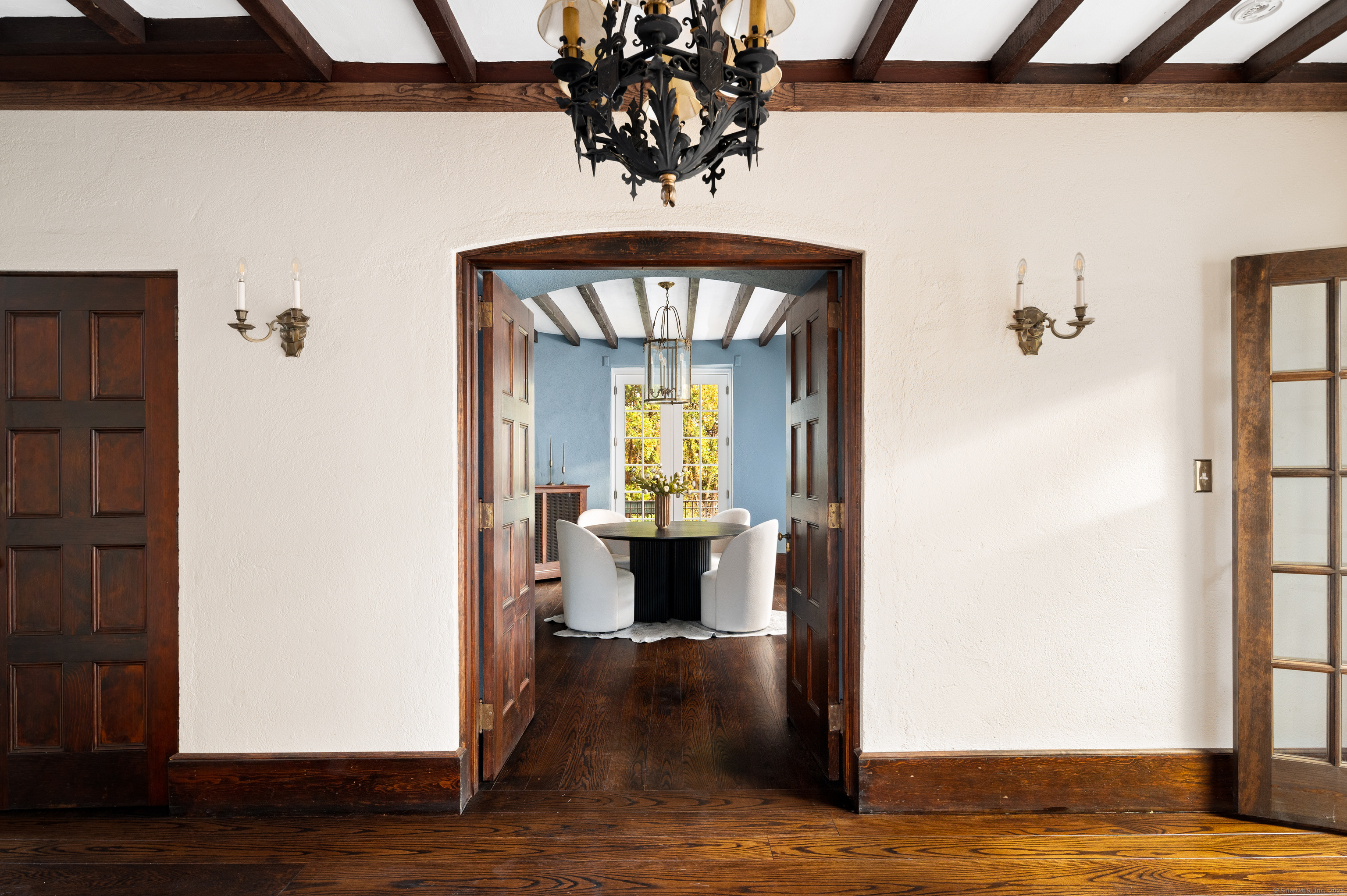 271 Hunting Ridge Road Stamford, CT 06903 - Photo 10 of 40 a view of a hallway with wooden floor and a dining room