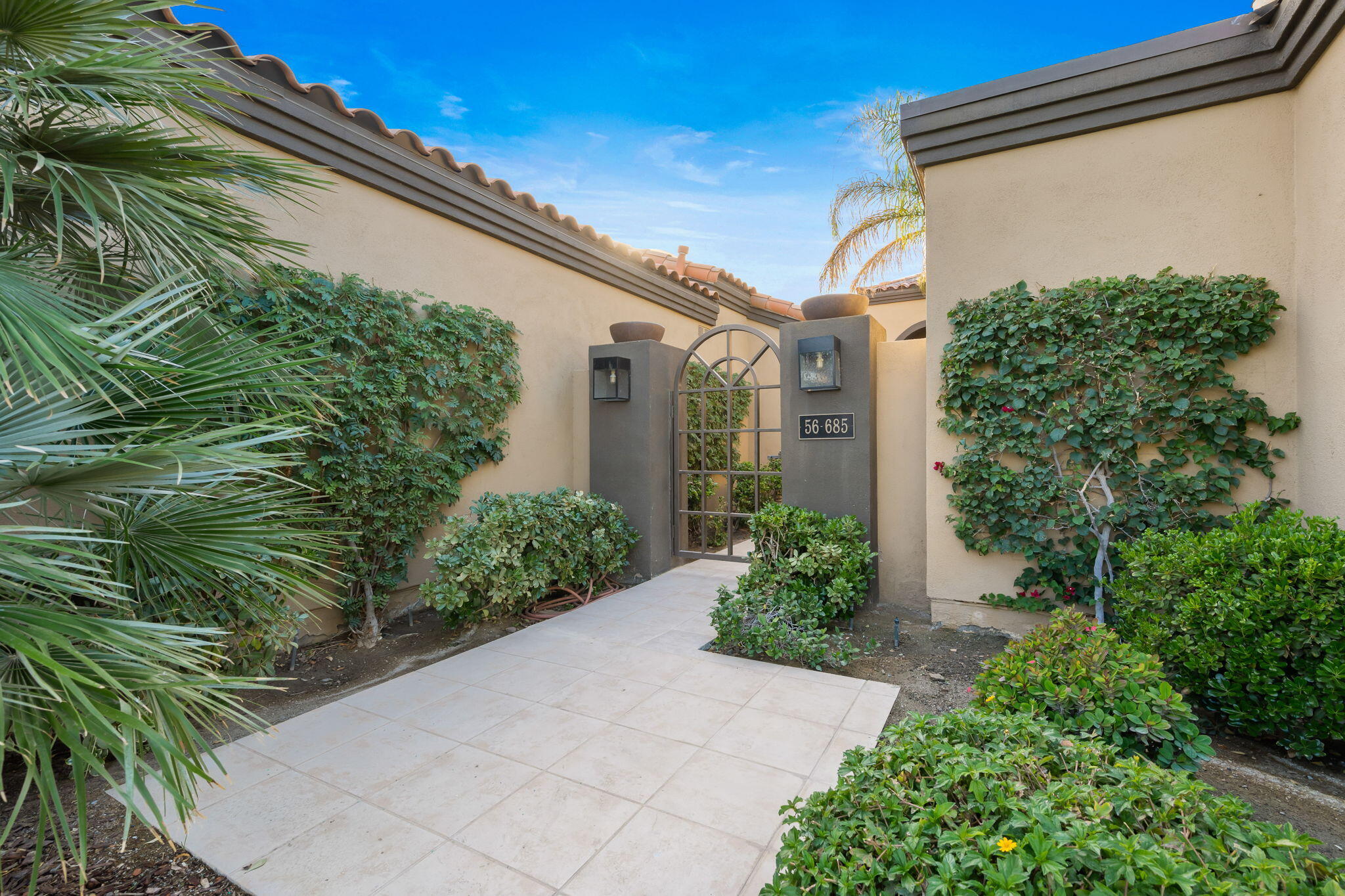 56685 Merion La Quinta, CA 92253 - Photo 16 of 82 a front view of a house with garden