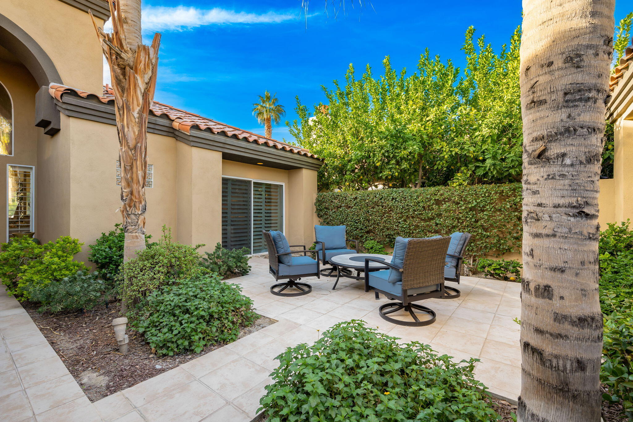 56685 Merion La Quinta, CA 92253 - Photo 18 of 82 a view of a backyard with sitting area and garden