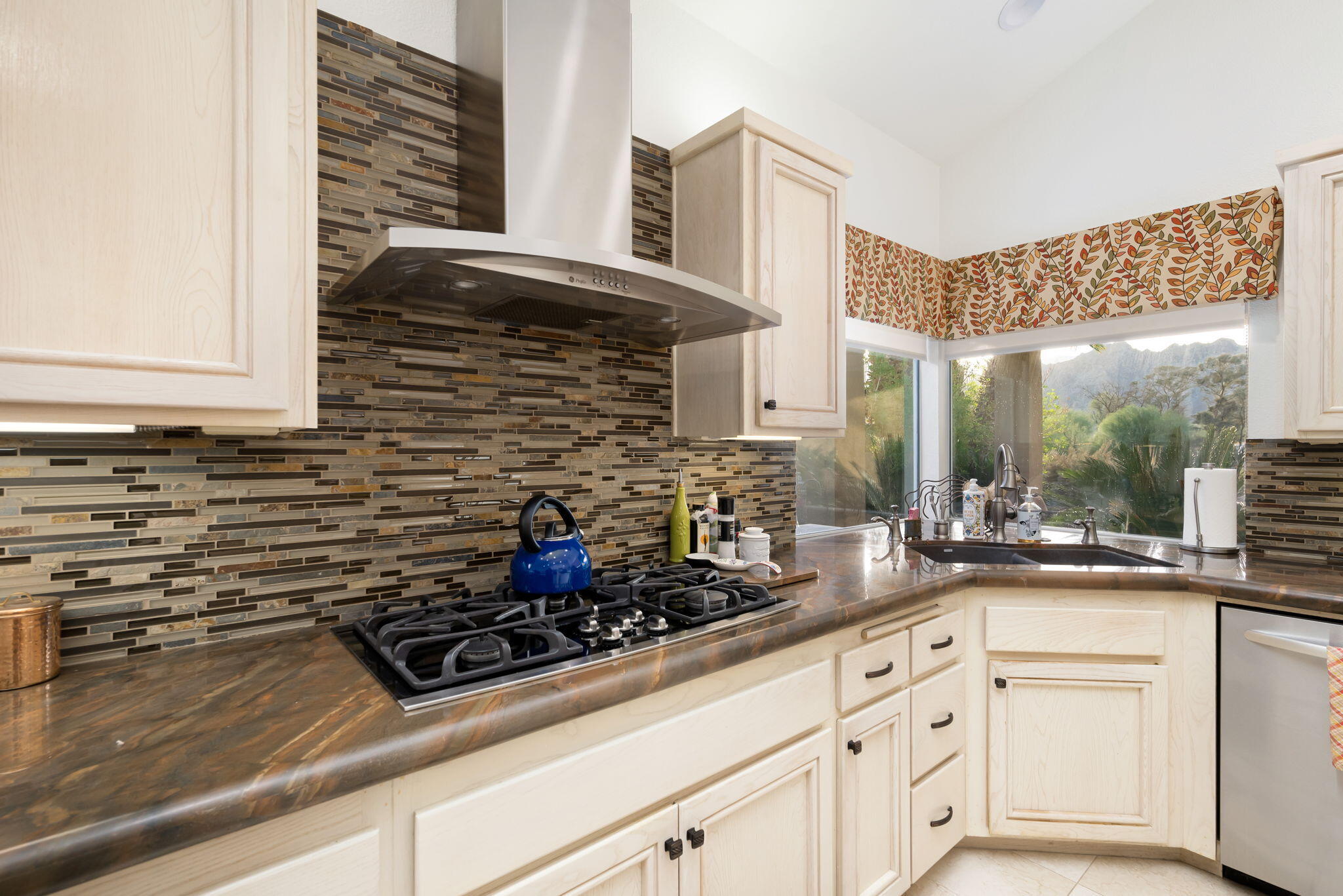 56685 Merion La Quinta, CA 92253 - Photo 33 of 82 a kitchen with stainless steel appliances a counter space and a window
