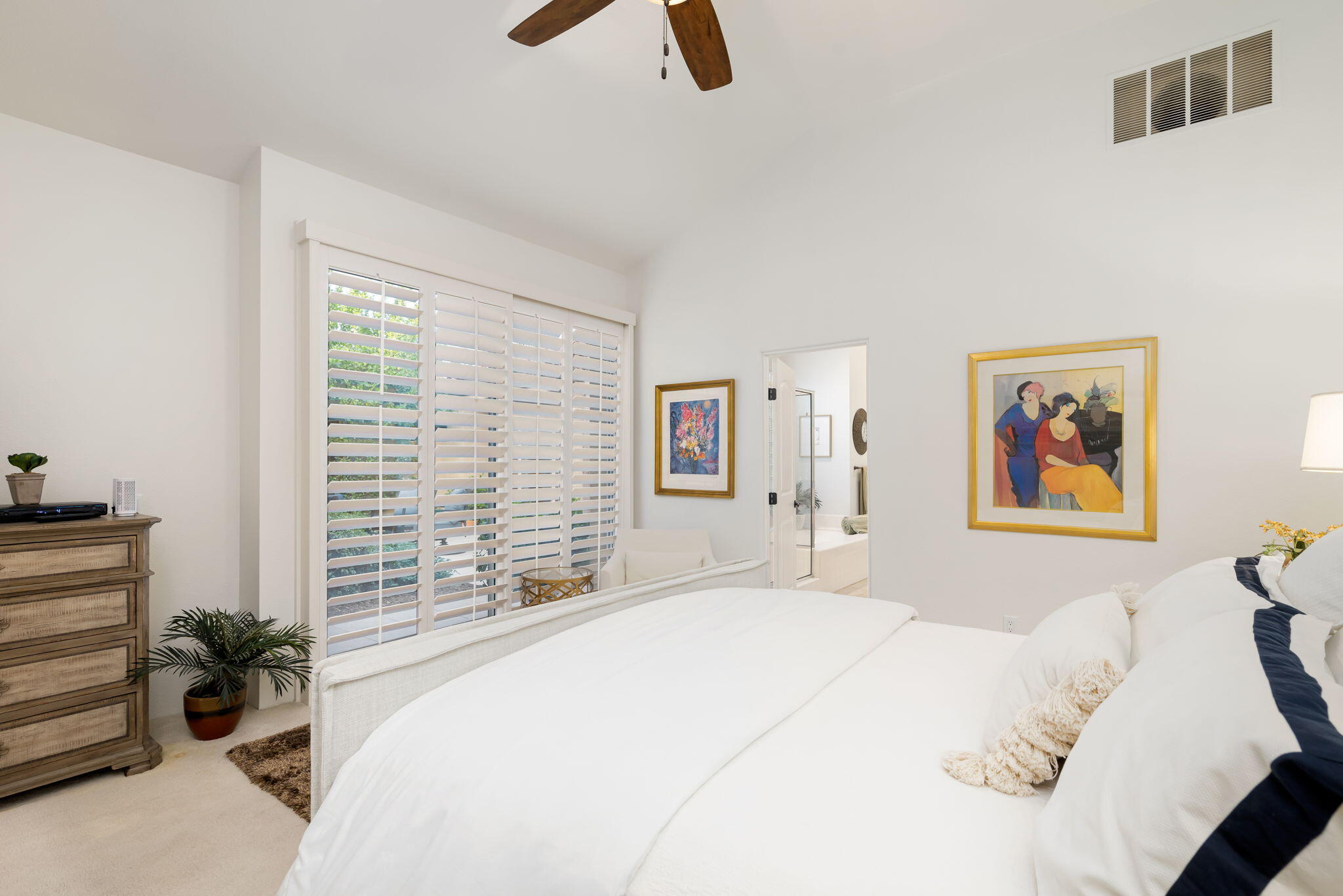 56685 Merion La Quinta, CA 92253 - Photo 41 of 82 a bedroom with a bed a couch and a window