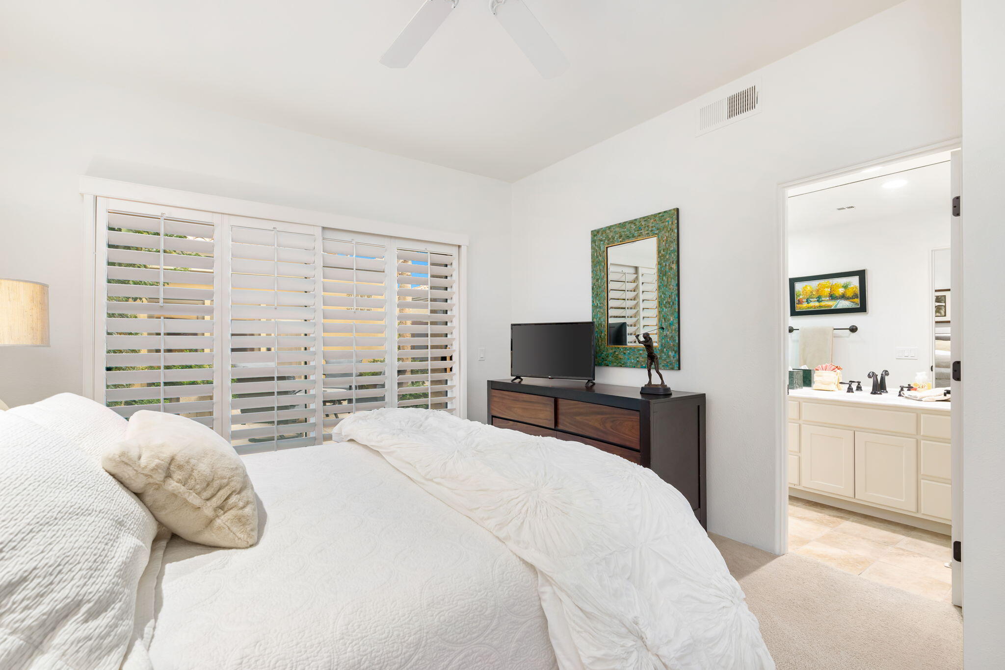 56685 Merion La Quinta, CA 92253 - Photo 49 of 82 a bedroom with a bed and a flat screen tv