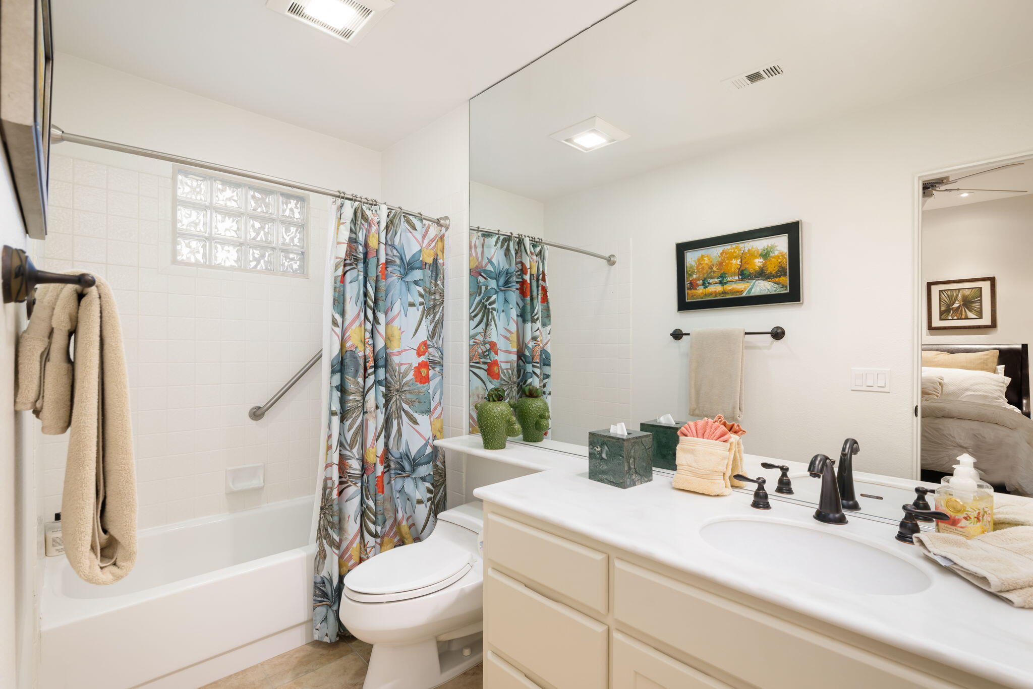 56685 Merion La Quinta, CA 92253 - Photo 50 of 82 a bathroom with a sink a toilet and a large mirror