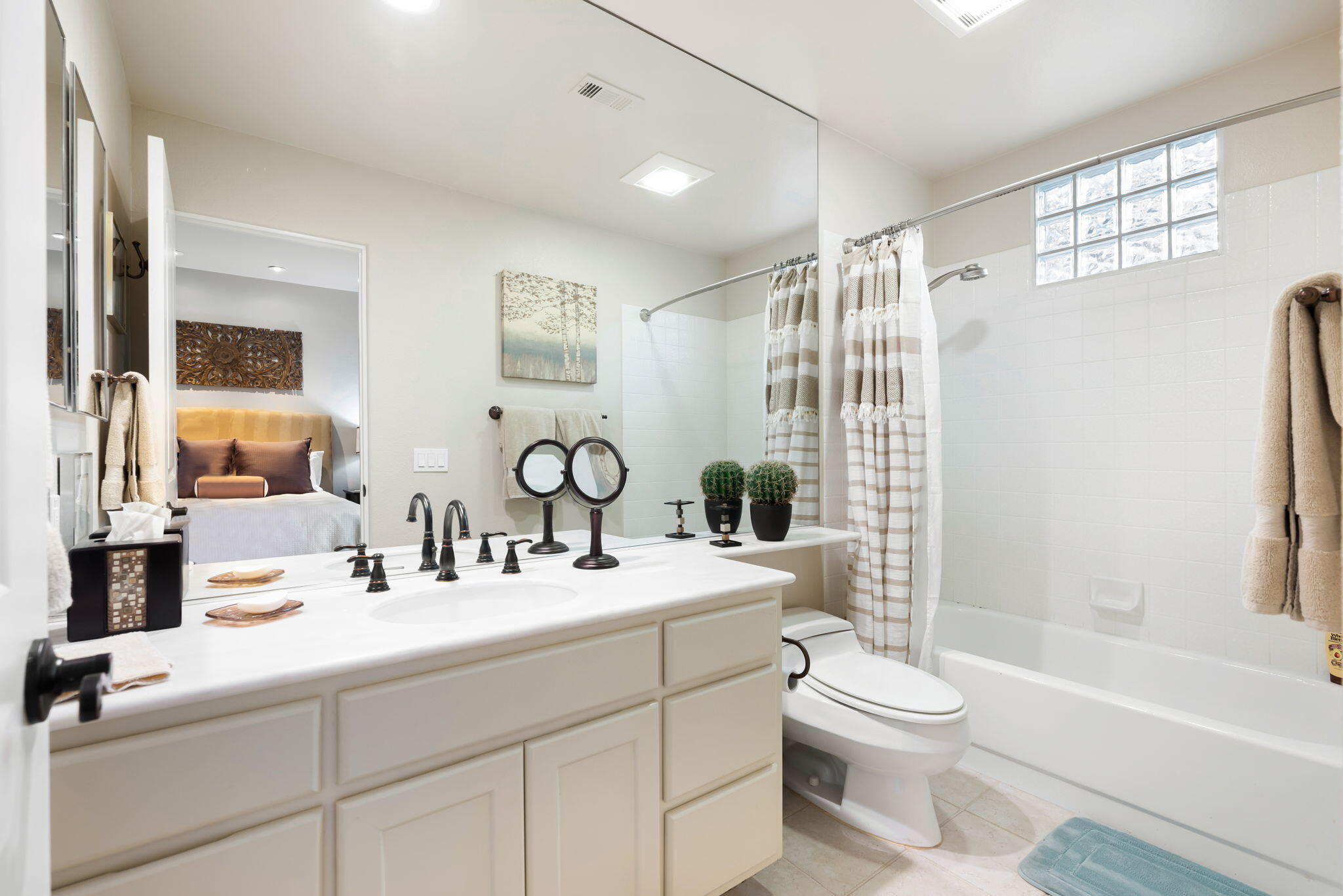 56685 Merion La Quinta, CA 92253 - Photo 53 of 82 a bathroom with a double vanity sink toilet mirror and shower