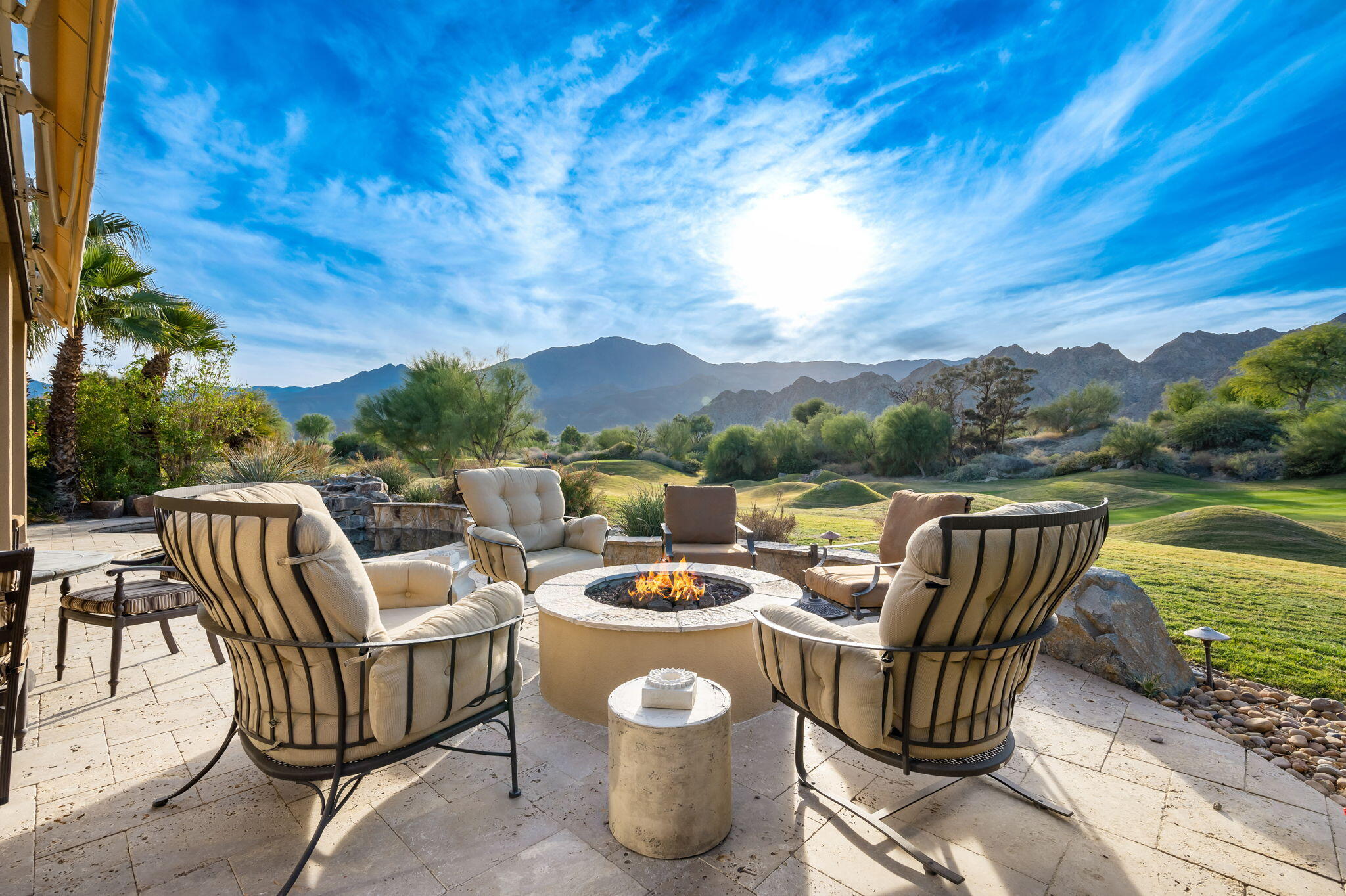 56685 Merion La Quinta, CA 92253 - Photo 59 of 82 a view of a patio with a table chairs and a fire pit