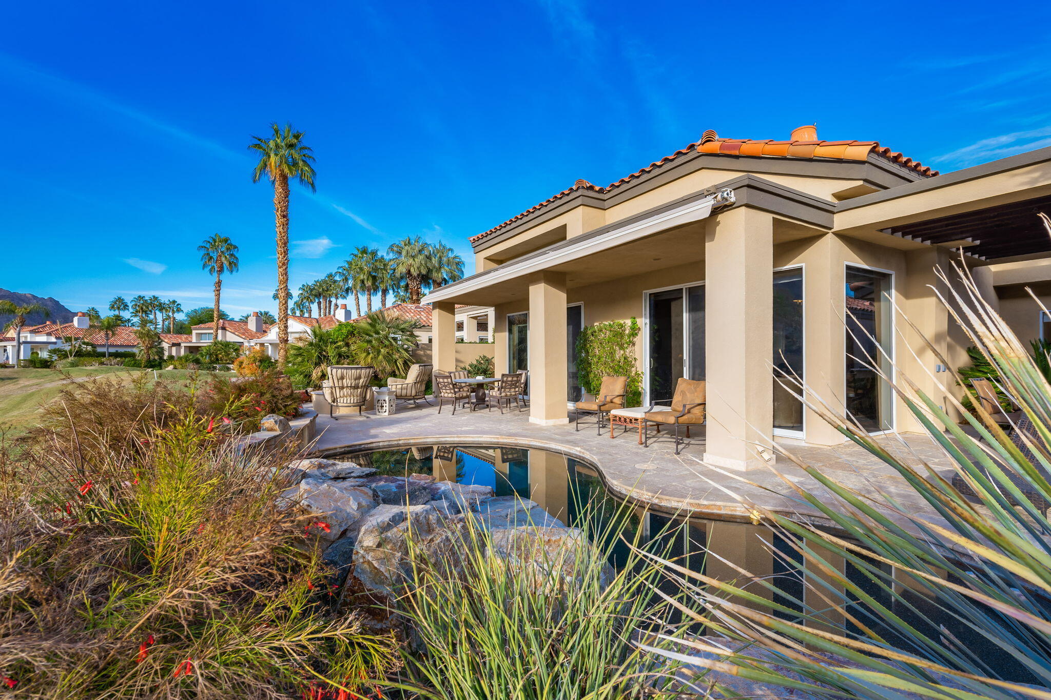 56685 Merion La Quinta, CA 92253 - Photo 63 of 82 a view of a house with backyard water fountain and sitting area