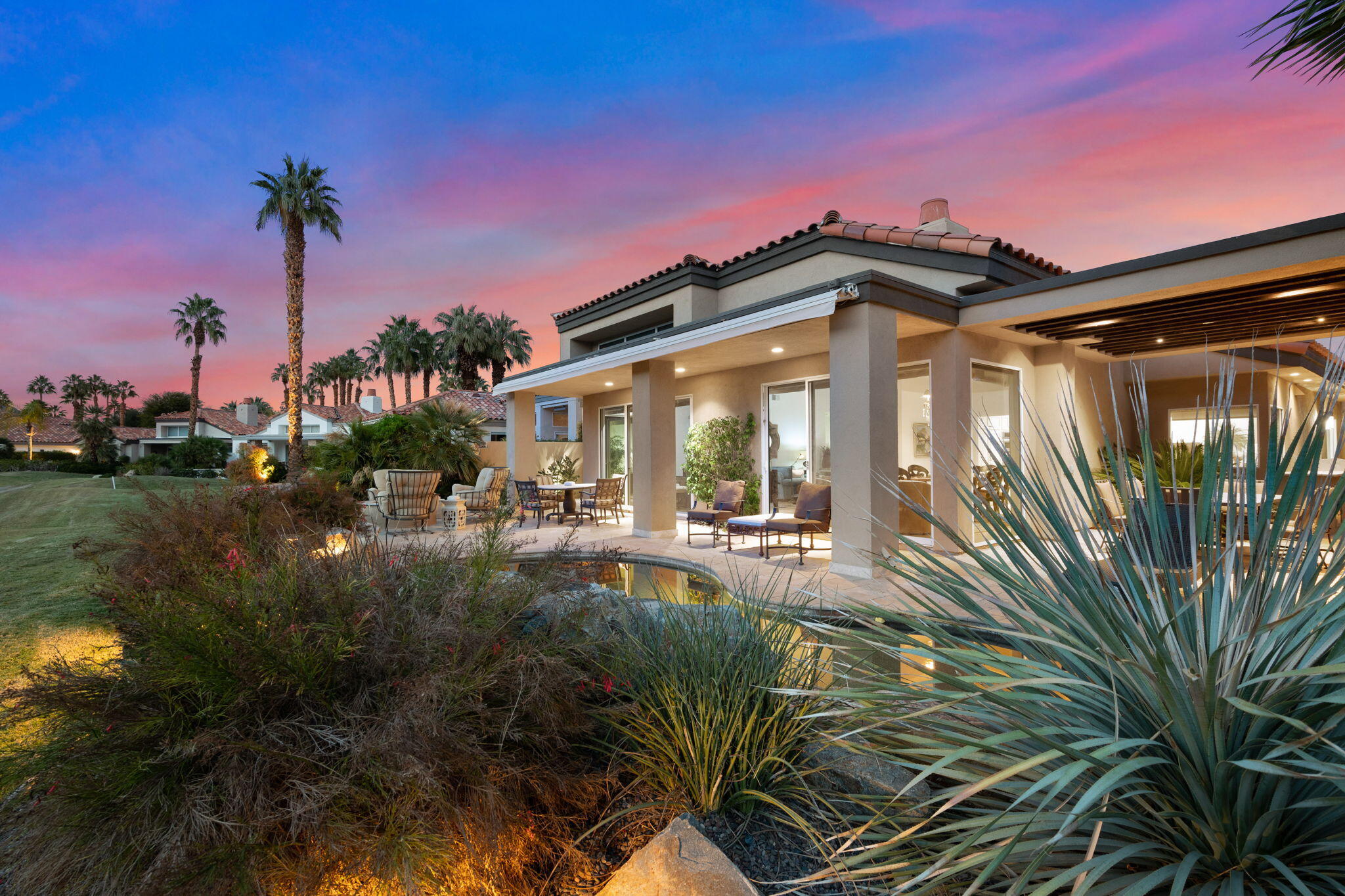 56685 Merion La Quinta, CA 92253 - Photo 10 of 82 a front view of a house with garden