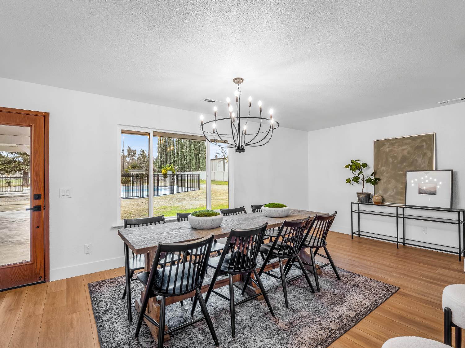 7284 West Rialto Avenue Fresno, CA 93723 - Photo 15 of 60 a view of a dining room with furniture window and wooden floor