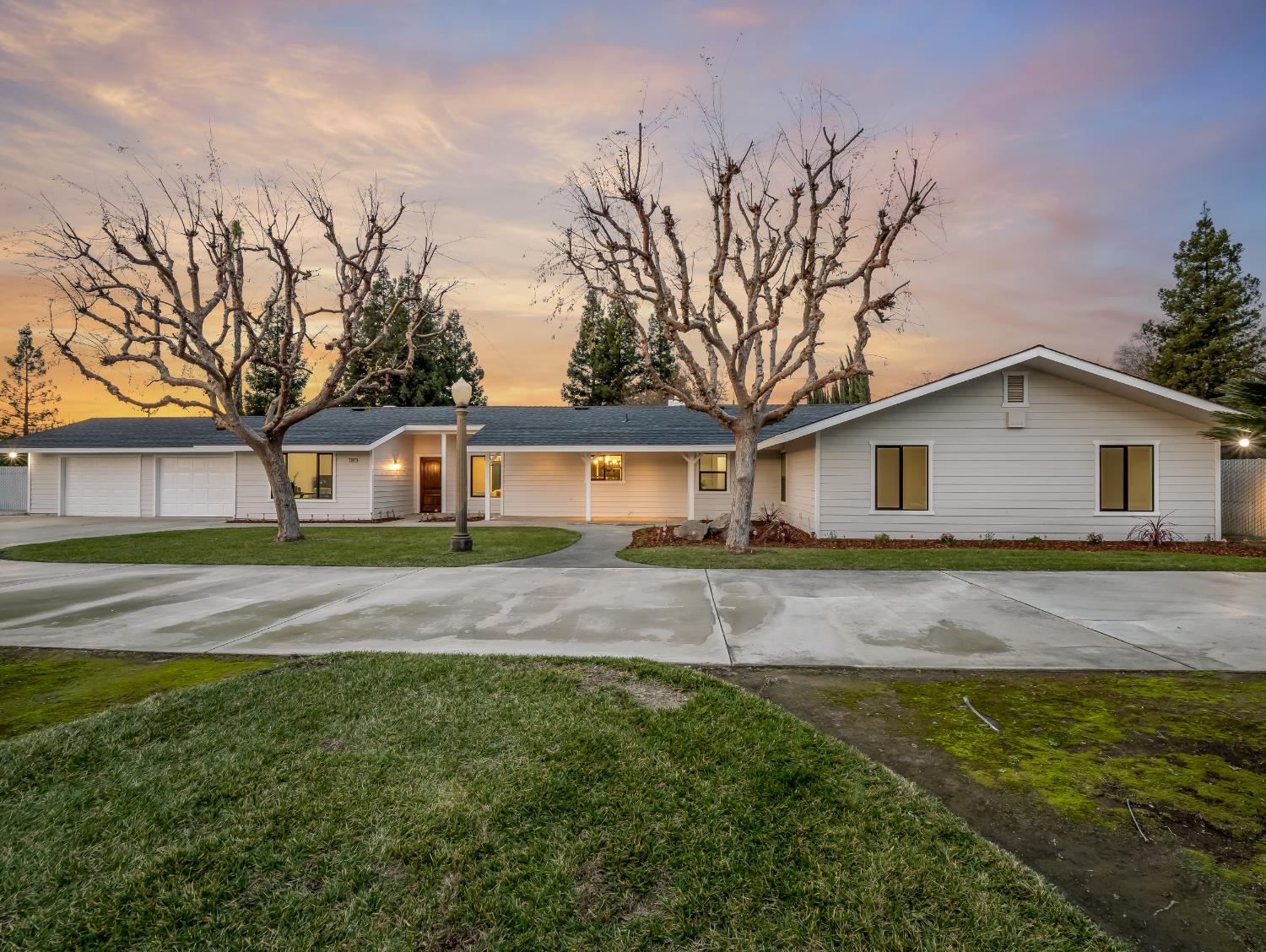 7284 West Rialto Avenue Fresno, CA 93723 - Photo 2 of 60 a view of a yard with a house in the background