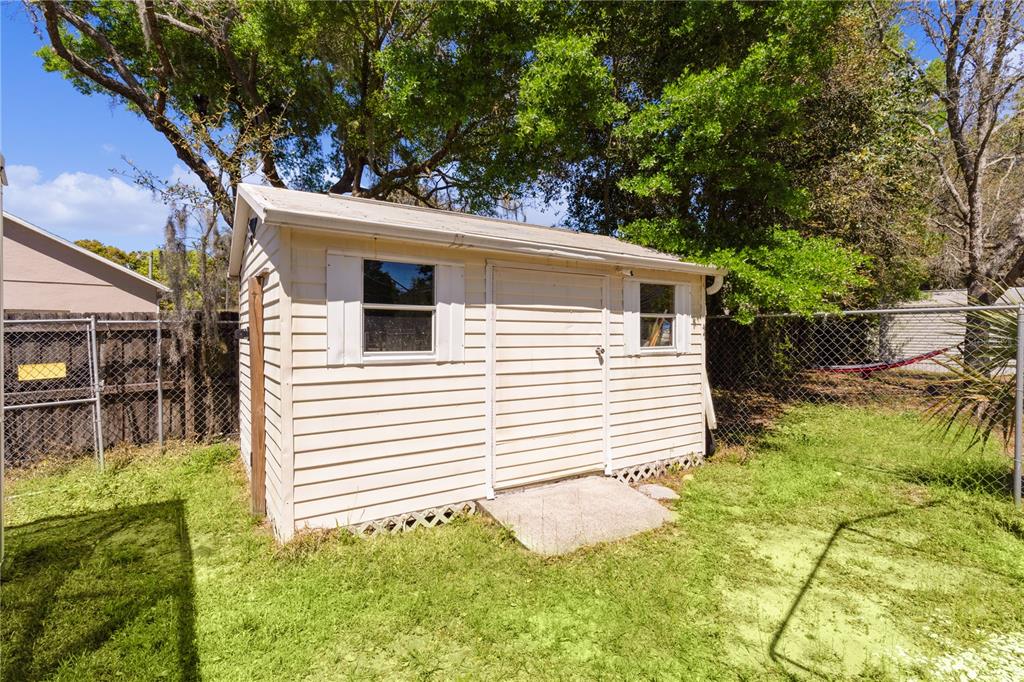 40045 Palm Street Lady Lake, FL 32159 - Photo 23 of 50 a view of a house with a yard