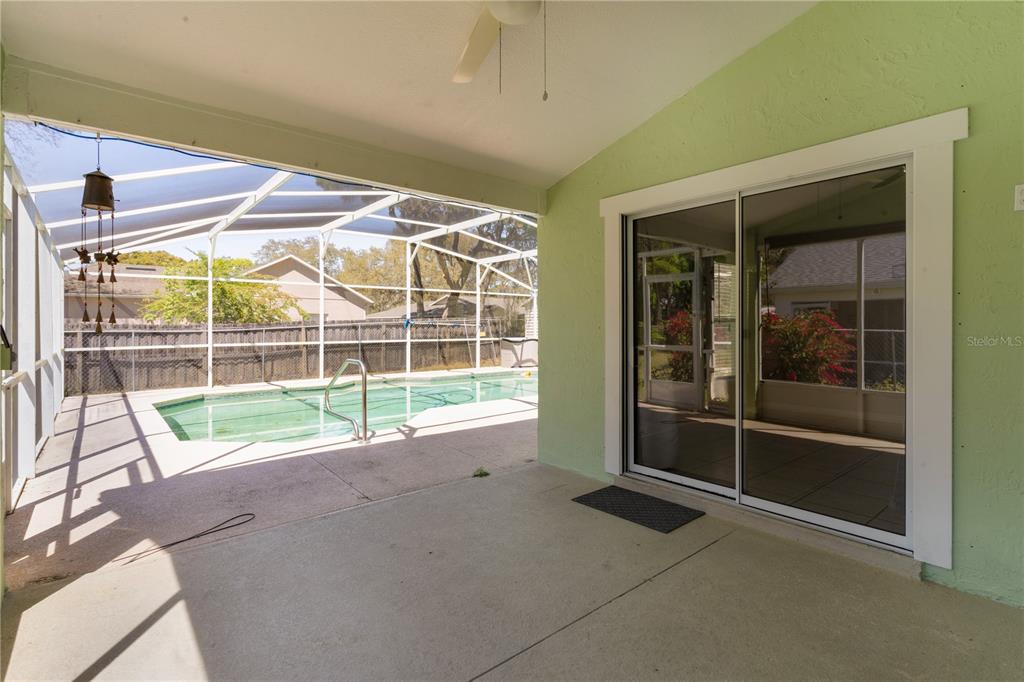 40045 Palm Street Lady Lake, FL 32159 - Photo 30 of 50 a view of an empty room with a sliding door