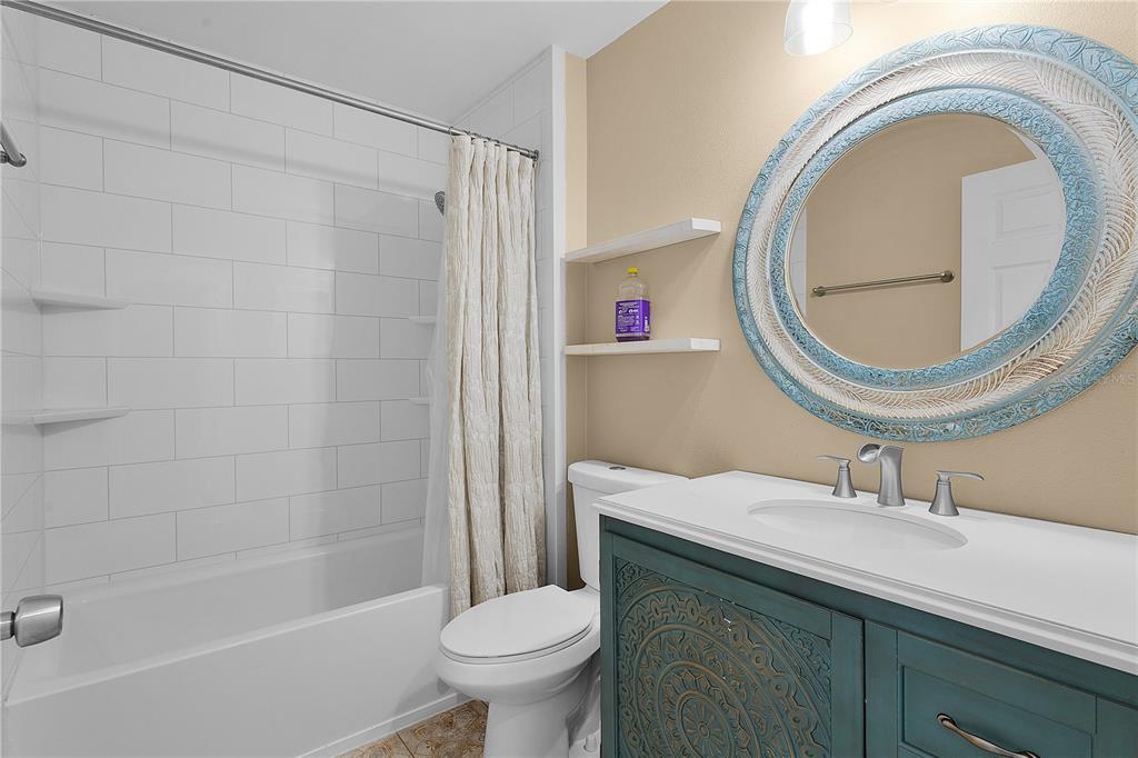 40045 Palm Street Lady Lake, FL 32159 - Photo 34 of 50 a bathroom with a sink a toilet and a mirror