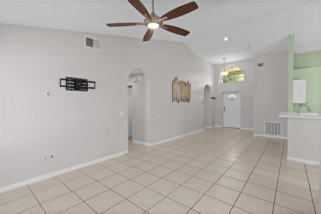 40045 Palm Street Lady Lake, FL 32159 - Photo 39 of 50 wooden floor in an empty room with a window