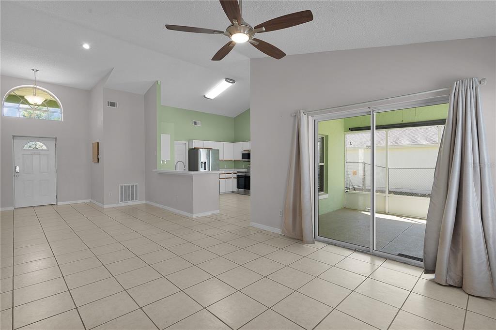 40045 Palm Street Lady Lake, FL 32159 - Photo 42 of 50 an empty room with fireplace and windows