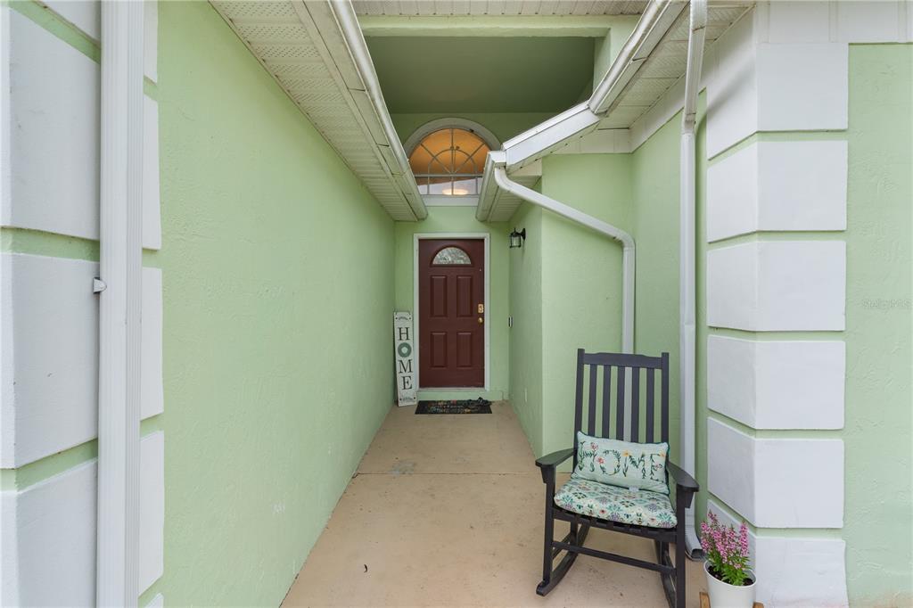 40045 Palm Street Lady Lake, FL 32159 - Photo 5 of 50 a view of entryway with a window and wooden floor
