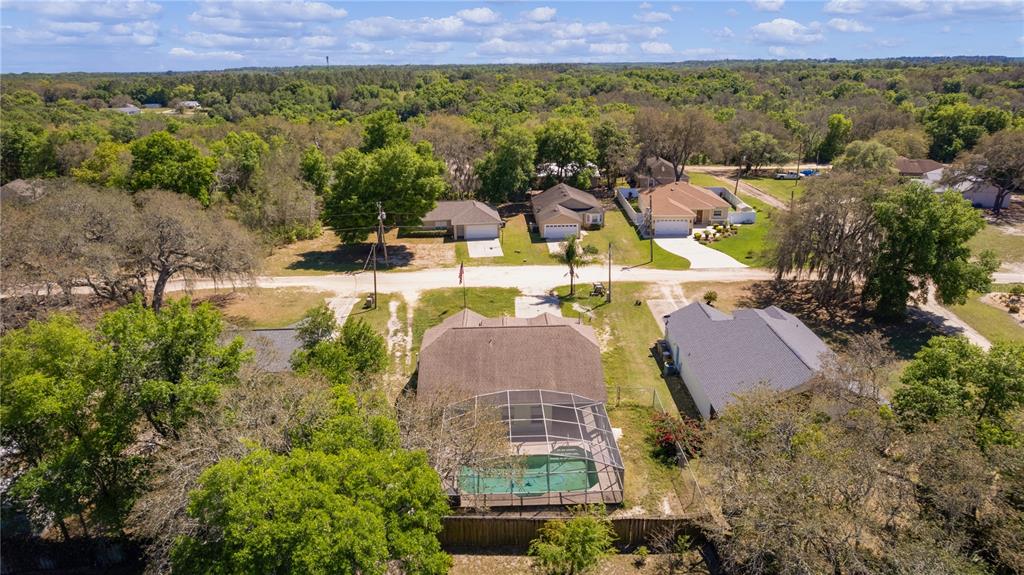 40045 Palm Street Lady Lake, FL 32159 - Photo 7 of 50 a view of a city with lawn chairs