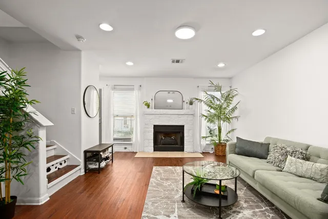 a living room with furniture and a fireplace