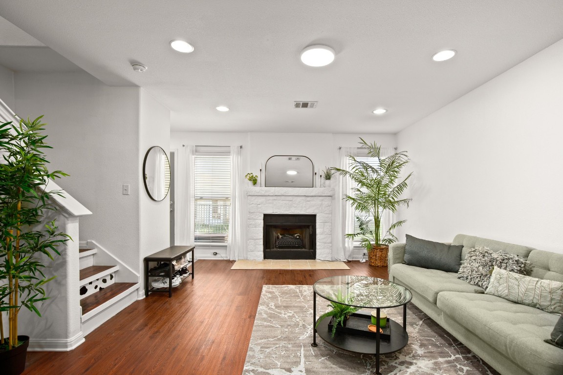 a living room with furniture and a fireplace