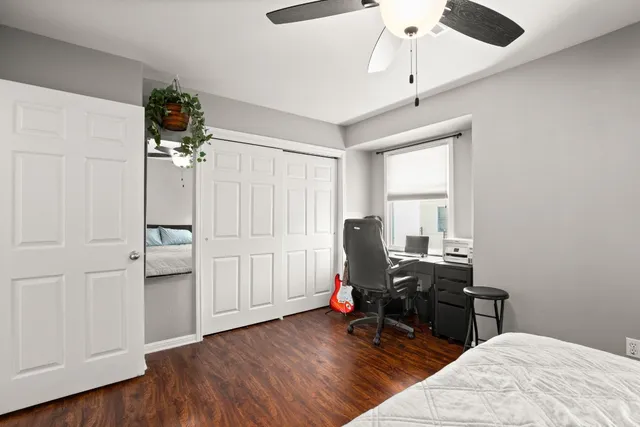 a view of a workspace with furniture and wooden floor