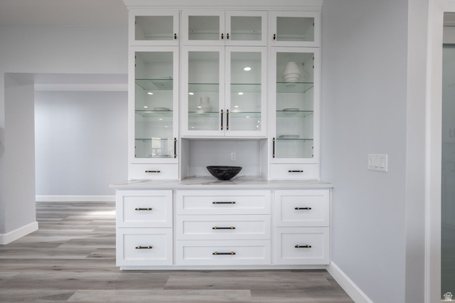 476 Spring Drive Toquerville, UT 84774 - Photo 20 of 95 Bar featuring white cabinets, light wood-style floors, and glass fronted cabinets